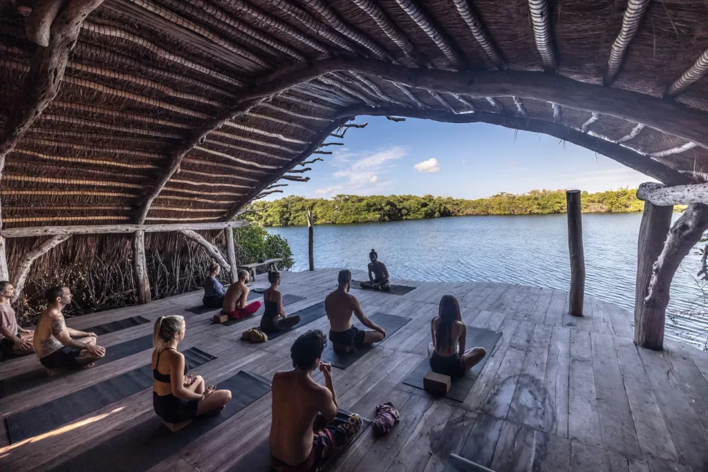 a man conducts meditation classes