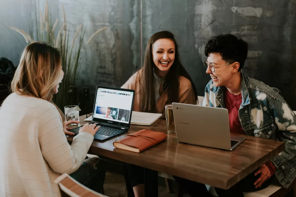 Three happy people working together