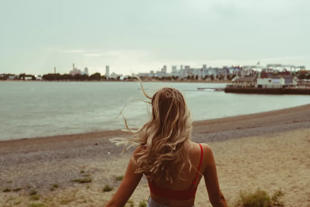 woman standing on beach during day